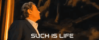 Man In Suit Facing Such Is Life Wall GIF