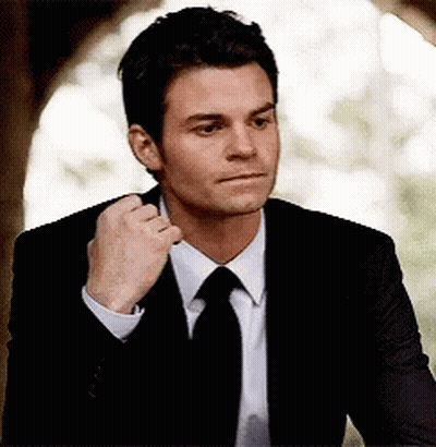 Man In Suit Fixing Tie GIF