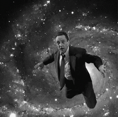 Man In Suit Flying Through Space GIF