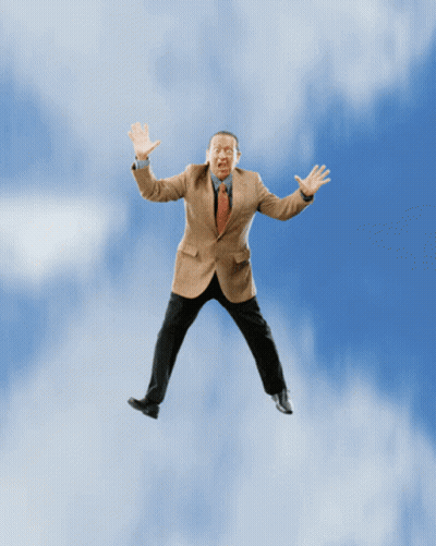 Man in Suit Flying With Arms Outstretched