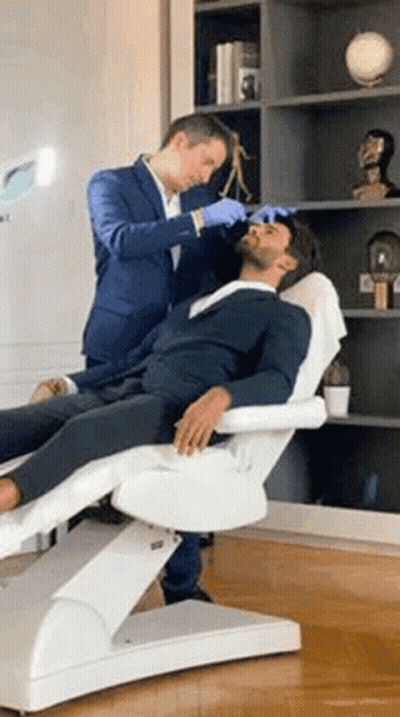 Man In Suit Getting Facial Treatment GIF