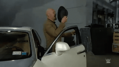 Man In Suit Getting Out Car With Top Hat GIF