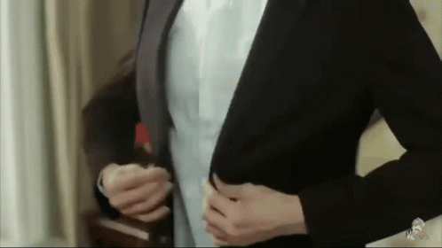 Man In Suit Getting Ready To Go Out GIF