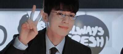 Man In Suit Giving Peace Sign In Front Of Always Fresh Sign GIF