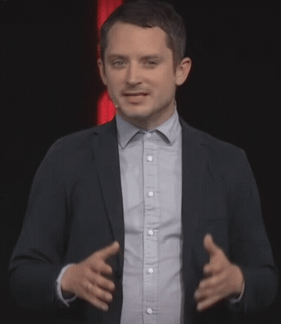 Man In Suit Giving Presentation GIF
