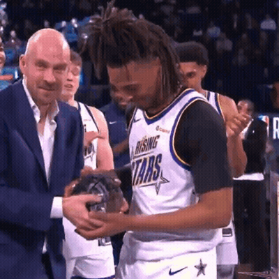 Man In Suit Giving Rising Stars Jersey GIF