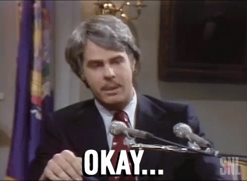 Man In Suit Giving Speech At Microphones Saying Okay GIF