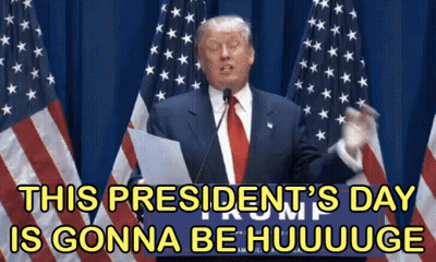 Man In Suit Giving Speech In Front Of American Flags GIF