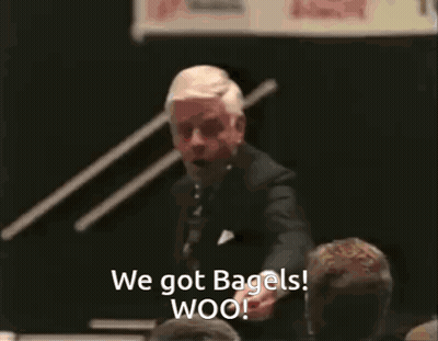 Man In Suit Giving Speech Says We Got Bagels Woo GIF