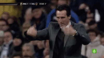 Man In Suit Giving Thumbs Up In Front Of Crowd GIF