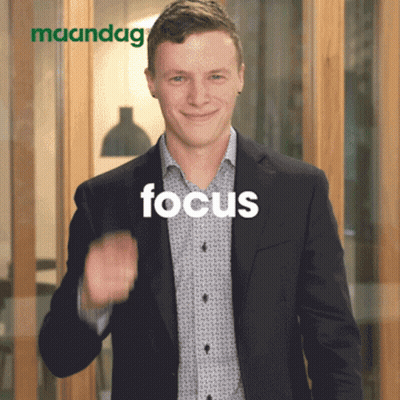 Man In Suit Giving Thumbs Up In Front Of Maandag Sign GIF