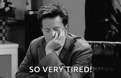Man In Suit Hand On Face Saying So Very Tired GIF