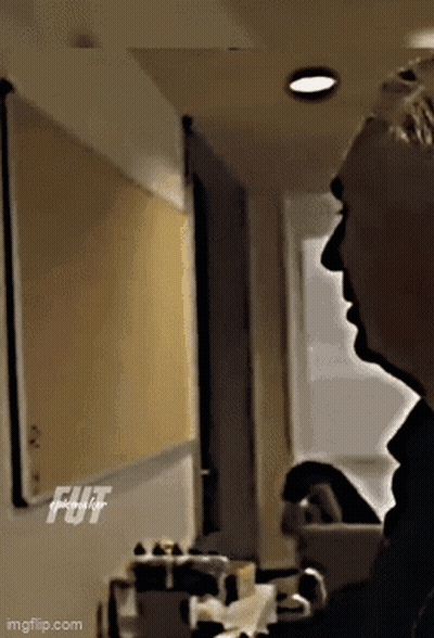 Man In Suit Hands In Pockets Dark Room GIF