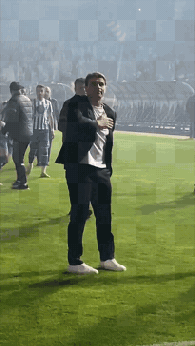 Man in Suit Hands on Chest