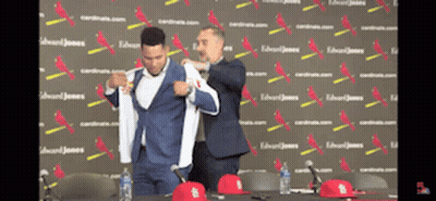 Man In Suit Helped By Another Man GIF