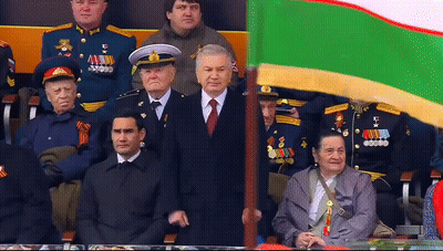 Man In Suit Holding AA Flag GIF