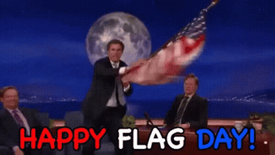 Man In Suit Holding American Flag GIF