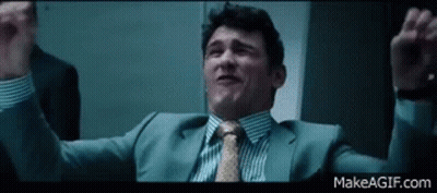 Man In Suit Holding Arms Up GIF