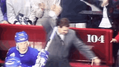 Man In Suit Holding Baseball Bat By Red Bench 104 GIF