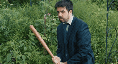 Man In Suit Holding Baseball Bat GIF