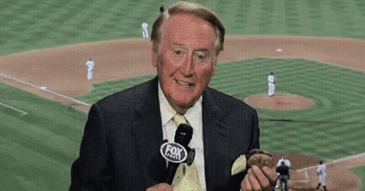 Man In Suit Holding Baseball In Front Of Fox Sports Logo GIF