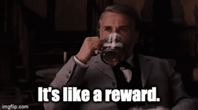 Man In Suit Holding Beer Says It's Like A Reward GIF