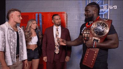 Man In Suit Holding Belt Saying Gold GIF