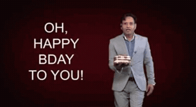 Man In Suit Holding Birthday Cake Saying Oh Happy Bday To You GIF