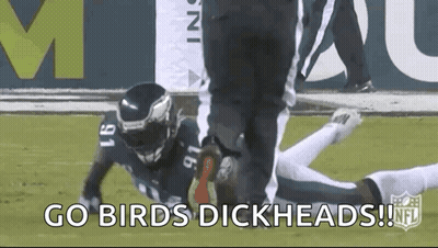 Man In Suit Holding Book With Jaguars Logo GIF