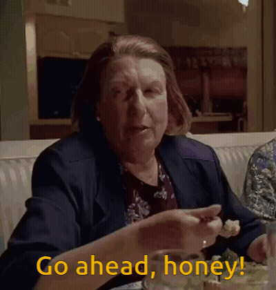 Man In Suit Holding Bottle Saying Go Ahead Read It GIF