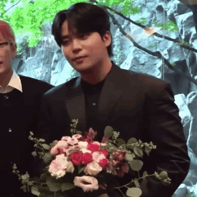 Man In Suit Holding Bouquet GIF