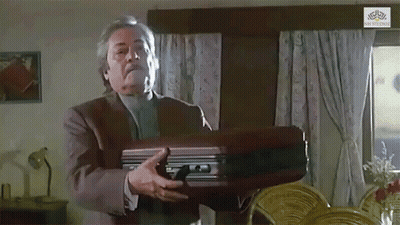 Man In Suit Holding Briefcase GIF