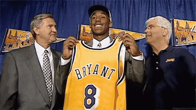 Man In Suit Holding Bryant 8 Jersey GIF