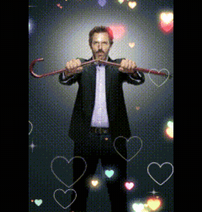 Man In Suit Holding Cane With Hearts GIF