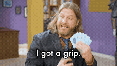 Man In Suit Holding Cards Saying I Got A Grip GIF