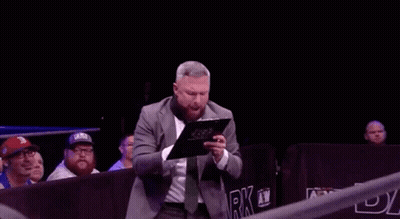 Man In Suit Holding Clipboard GIF