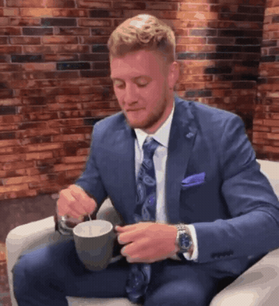 Man In Suit Holding Coffee GIF