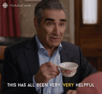 Man In Suit Holding Coffee Saying This Has All Been Very Very Helpful GIF