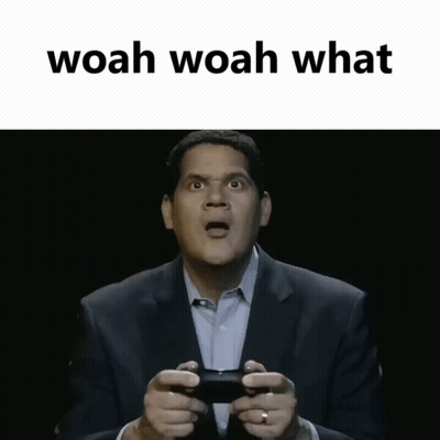 Man In Suit Holding Controller Saying Woah Woah What GIF