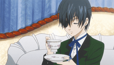 Man In Suit Holding Cup Of Tea GIF