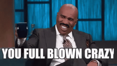 Man In Suit Holding Cup Smiling You Full Blown Crazy GIF