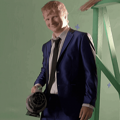 Man In Suit Holding Fan GIF