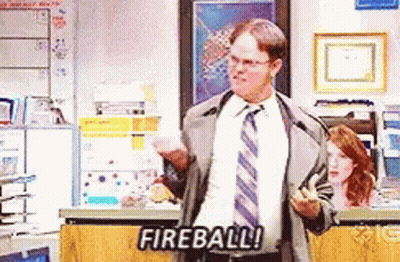 Man In Suit Holding Fireball GIF