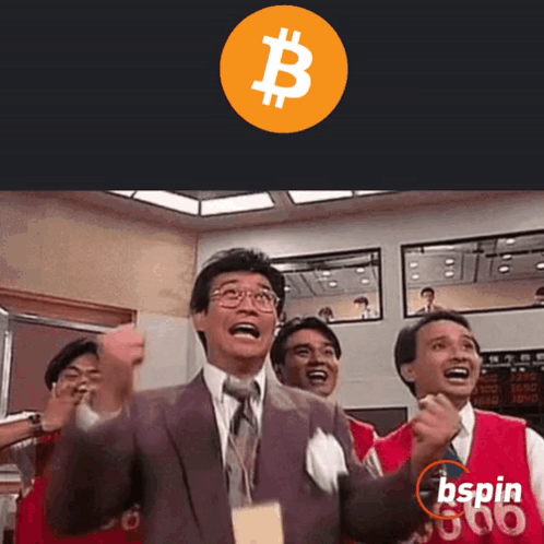 Man In Suit Holding Fist In Air In Front Of Bspin Sign GIF