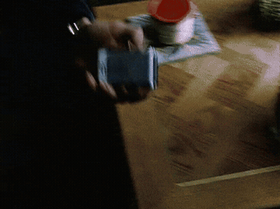 Man In Suit Holding Flip Phone Saying Found It GIF
