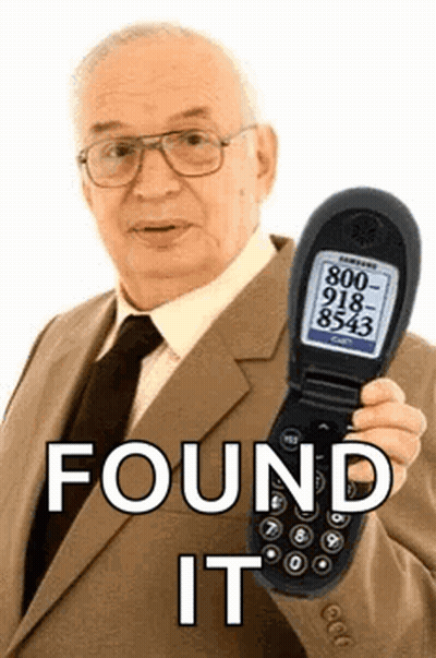Man In Suit Holding Flip Phone Saying Found It GIF