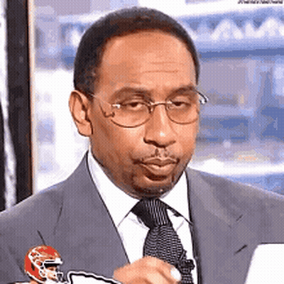 Man In Suit Holding Football Helmet GIF