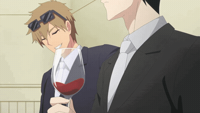 Man In Suit Holding Glass Of Red Wine GIF