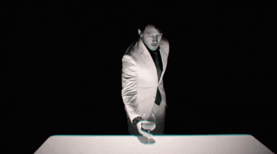 Man In Suit Holding Glass Of Wine GIF