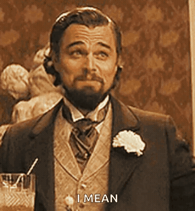 Man In Suit Holding Glass GIF